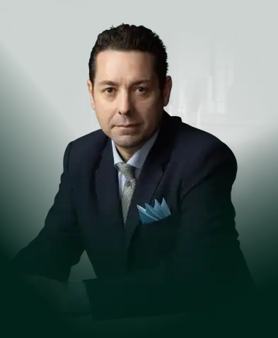 Attorney David Volk in formal attire, showcasing confidence and professionalism.