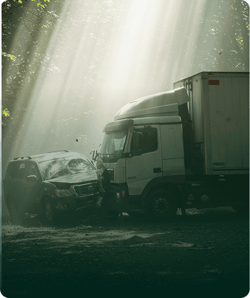 Car and truck collision in a forested area, highlighting personal injury cases.